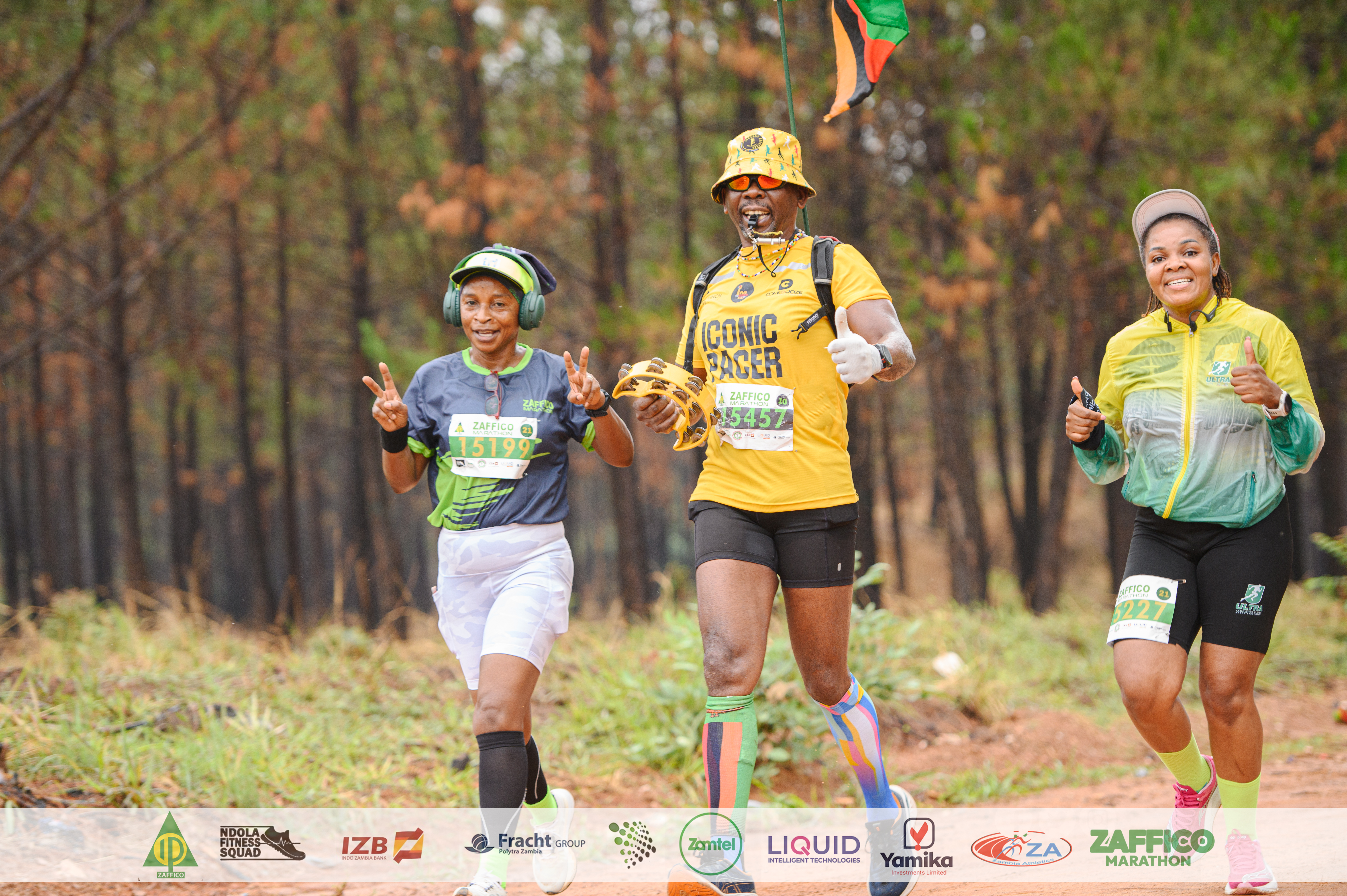 ZAFFICO Marathon runners celebrating together on a forest course